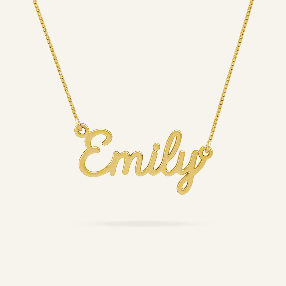 Close-up of a personalized "Emily" name necklace crafted from 24k gold-plated sterling silver, featuring a delicate box